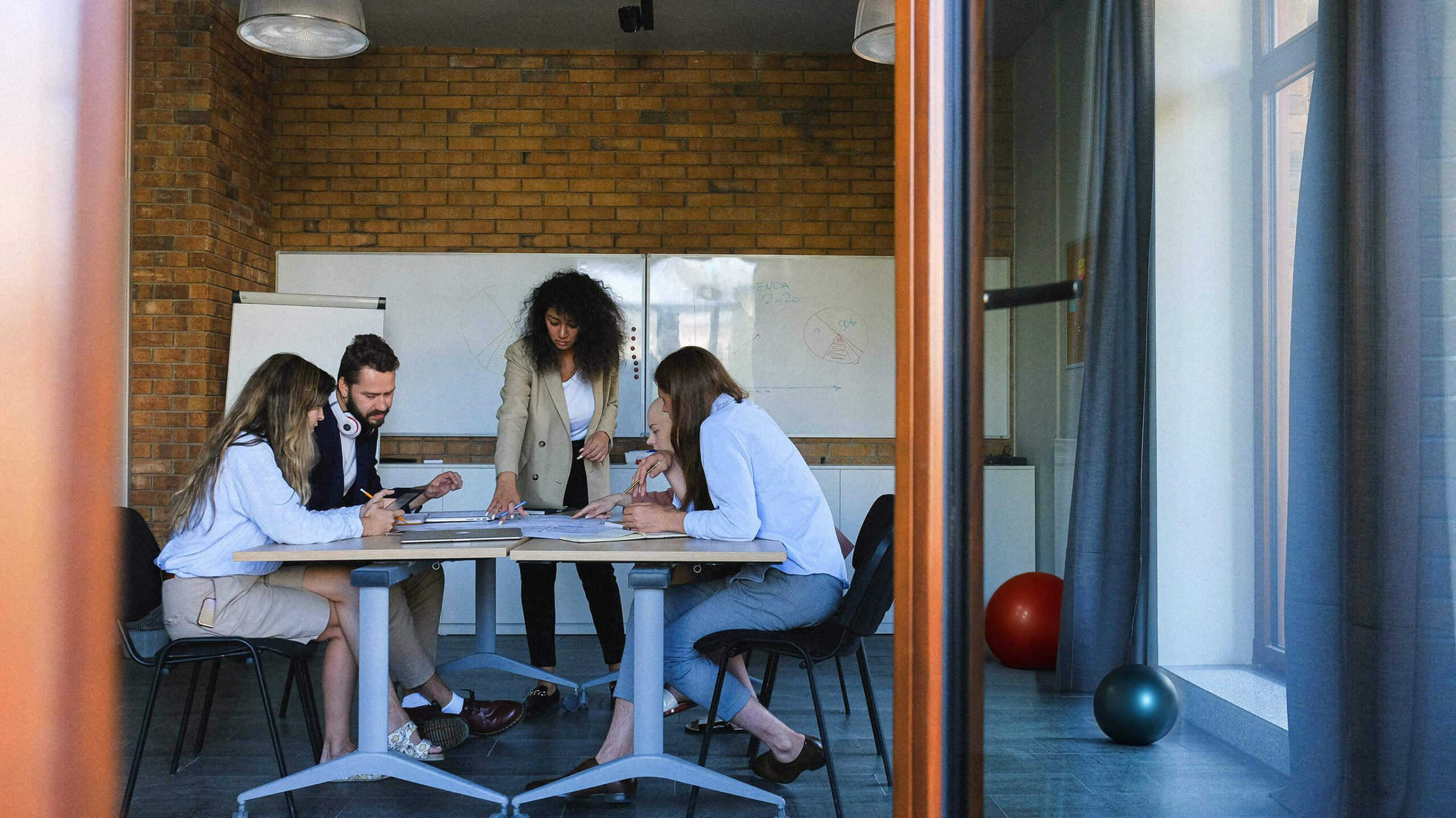 image shows a technical documentation team at work