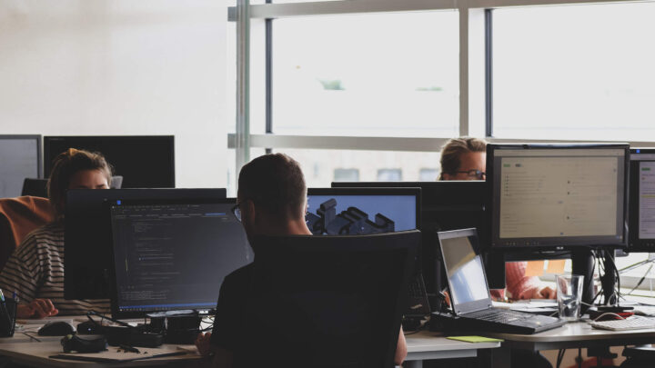 image shows people working on computers